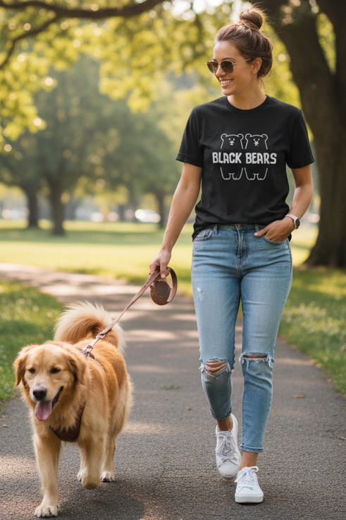 Woman walking a dog wearing black tshirt with black bears merch logo print